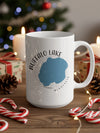 White mug with "Buffalo Lake Minnesota" map graphic and festive holiday decorations.