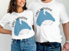 White t-shirts with Lake Manawa Iowa graphic and compass rose detail.