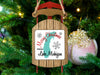 Sled ornament with "Merry Christmas FROM Lake Michigan" on a Christmas tree.