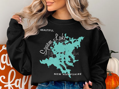 Black sweatshirt with a teal map of Squam Lake, New Hampshire.