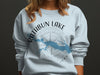 Light blue sweatshirt with a RATHBUN LAKE IOWA map and compass graphic.