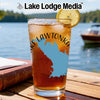 Glass of iced tea with Lake Lawtonka map design and lemon slice, Lake Lodge Media logo.