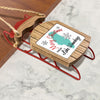 Wooden sled ornament with "Merry Christmas from Lake Winnebago" text.