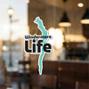 Windermere Life sticker on glass with blurry background