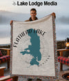 Throw blanket featuring a teal Flathead Lake, Montana map and compass design.