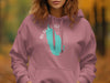 Pink hoodie on a person with a turquoise map of Black Lake New York design.