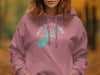 Pink hoodie with graphic depicting a teal lake outline and compass with "Your Custom Lake" text.