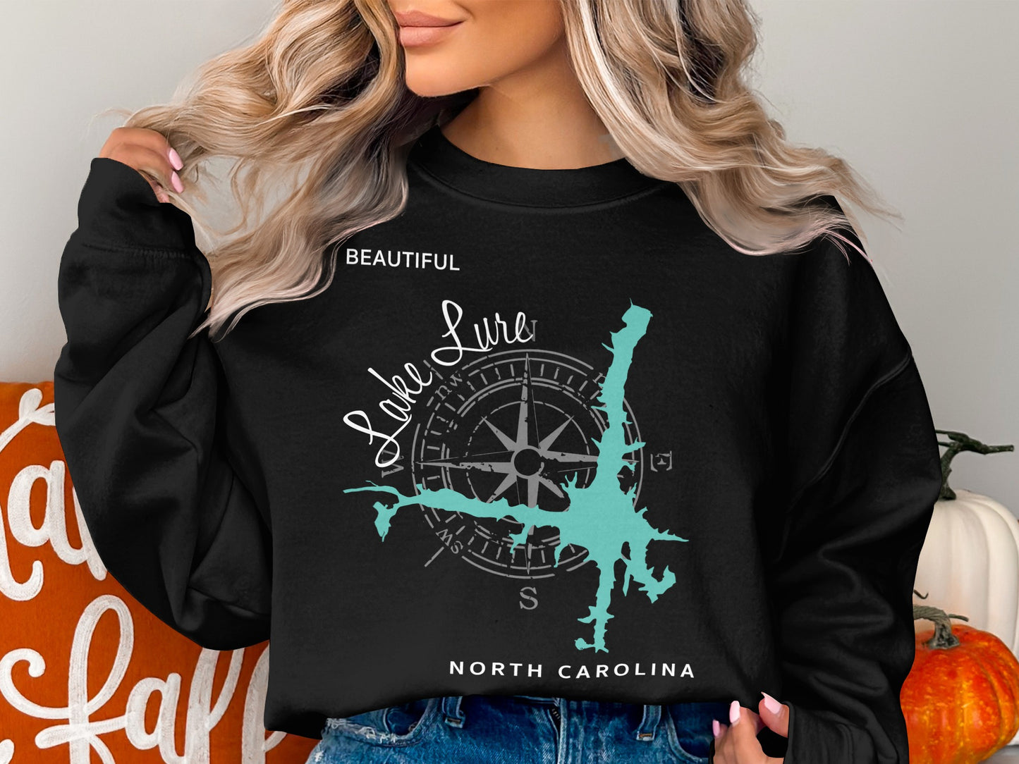 Black sweatshirt with "Lake Lure North Carolina" and compass design.