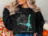 Black sweatshirt with "Lake Lure North Carolina" and compass design.