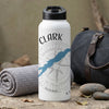 White water bottle with black lid and compass design featuring the word CLARK.
