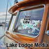 Tims Ford Life sticker on a wooden boat window with Lake Lodge Media logo.