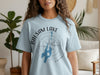 Light blue t-shirt with "Balsam Lake Ontario" text and compass rose graphic.
