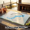 A textured glass cutting board printed with a compass rose and Lake Wallenpaupack, Pennsylvania.