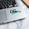 Kiawah Life sticker on a laptop keyboard with a marble background.