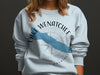 Light blue crewneck sweatshirt with Lake Wenatchee Washington text and graphic.