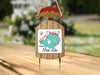 Sleigh ornament with "Merry Christmas from Mono Lake" text and snowflakes.