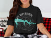 Black t-shirt with a teal outline of Lake Rayburn, Arkansas and compass graphic.