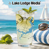 Glass with drink and lime on beach with Lake Springfield map and compass.