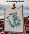 Woven blanket featuring Lake Martin Alabama design with compass rose graphic.