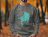 Gray sweatshirt with turquoise Lake Simcoe, Ontario map design.