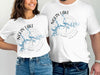 White t-shirts with "Nolin Lake Kentucky" graphic, featuring a compass rose and lake map.