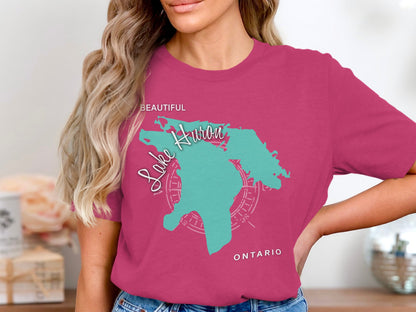 Pink t-shirt with Lake Huron map and compass graphic and text.