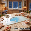 A rectangular glass cutting board featuring a map of Indian Lake, Ohio, rests on a granite kitchen counter amid baking ingredients.