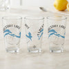 Three glasses with "Flagstaff Lake" text, blue lake map, and compass rose design.