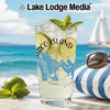Glass with drink and lime on beach with sailboat. "Marco Island" text on glass.