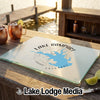 A glass cutting board featuring a blue map of Lake Rampart Colorado rests on a wooden outdoor bar.