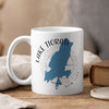 White mug with blue Lake Tiorati map and compass graphic.