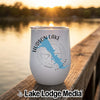 A white insulated wine tumbler featuring a blue map of Hudson Lake, Oklahoma, resting on a wooden dock.