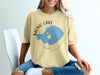 Yellow t-shirt with graphic of Mono Lake, California and compass.