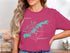 Pink t-shirt with compass rose graphic and Prior Lake, Minnesota map.