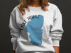 White sweatshirt with "Lake Tahoe California" around a blue lake outline.