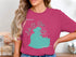 Woman wearing a pink t-shirt with Lake St. Clair Michigan graphic.