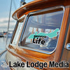 Turquoise Geneva Life sticker on a boat window, with Lake Lodge Media text.