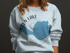 Light blue sweatshirt with "Glen Lake Michigan" and compass design.