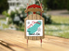 Sled ornament with "Merry Christmas from Connixt Lake" text and snowflakes.