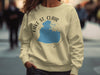 Light yellow crewneck sweatshirt with blue Lake St. Clair Michigan map graphic.