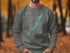 Grey sweatshirt with a compass rose and "Key Largo" text.