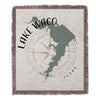 Lake Waco Texas map design with compass rose on fringed blanket.