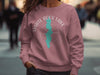 Dusty rose sweatshirt with white "White Rock Lake Texas" compass graphic.