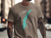 Taupe t-shirt with Yale Lake map and compass graphic in teal and white.