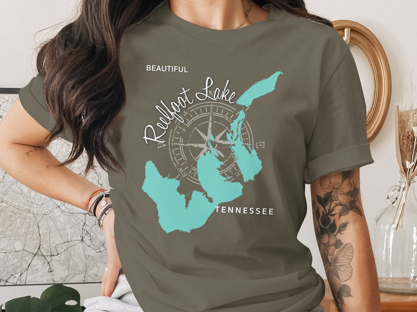 Green t-shirt with a teal map of Reelfoot Lake, Tennessee and compass graphic.