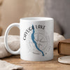 White mug with Cayuga Lake map, compass, and New York text.