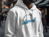White hoodie with "Geneva Lake Wisconsin" design, featuring a blue lake map and compass.