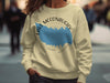 Cream sweatshirt with blue Lake McConaughy map and Nebraska text.