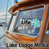 "Pactola Life" sticker on a boat window, with "Lake Lodge Media" text.