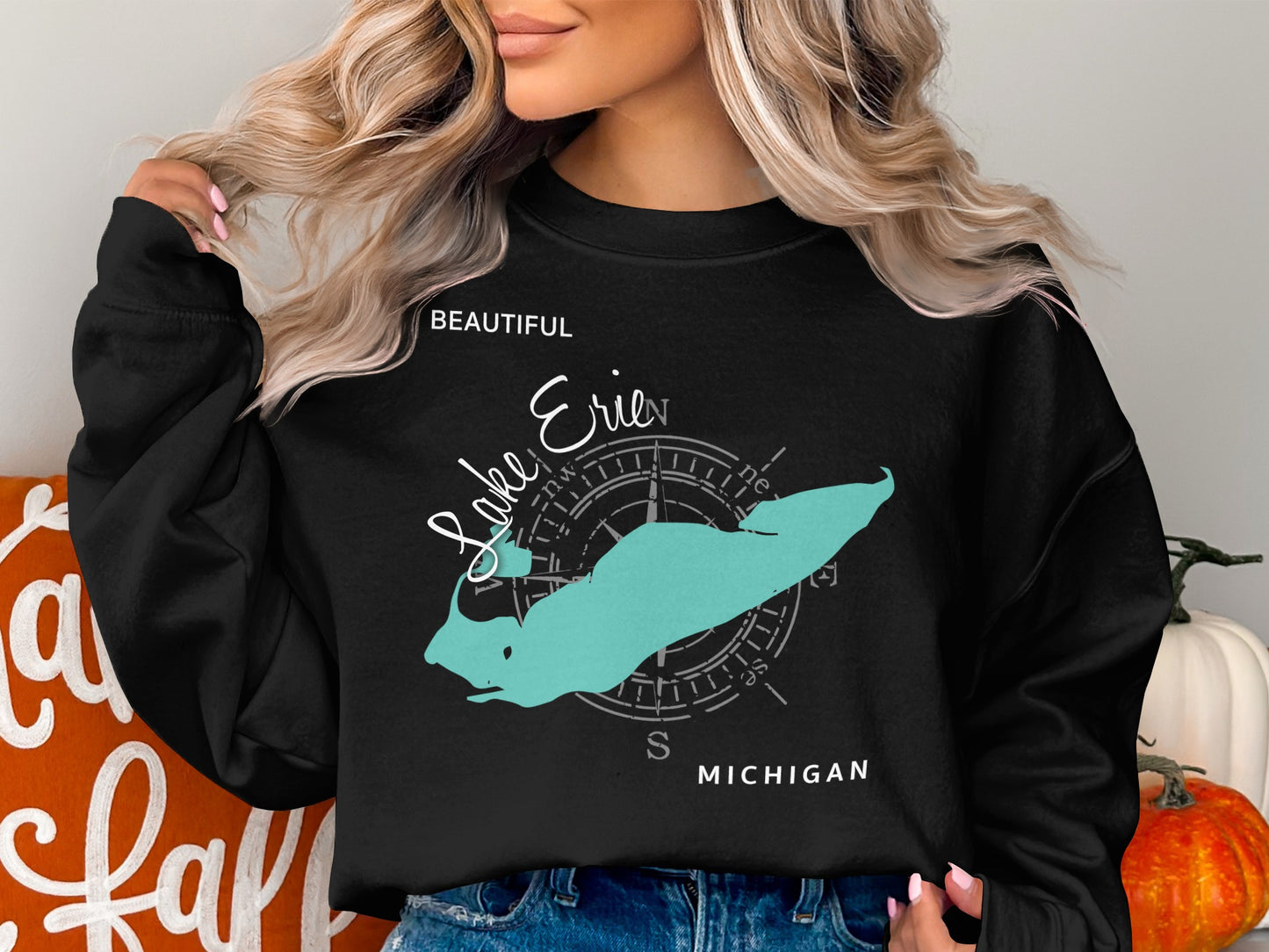 Black crewneck sweatshirt featuring a teal map of Lake Erie with compass rose.